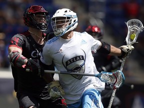 Atlas’ Kevin Unterstein (right) tries to fend off Chaos’ Jake Froccaro during a Premier Lacrosse League game in June at Harrison, N.J.  (Jason DeCrow/AP Images for Premier Lacrosse League)