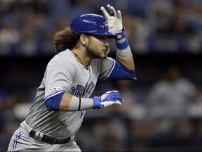Blue Jays’ Bo Bichette, watching his home run clear the fence at the Trop on Monday, is more of a doubles hitter, says his dad, Dante. Bo now has a team-record eight-game doubles streak after hitting another one yesterday.  Chris O’Meara/AP