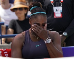 Serena Williams wipes a tear from her eyes after withdrawing fro the final against Bianca Andreescu. (John E. Sokolowski/USA TODAY)