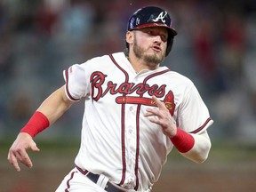 Atlanta Braves third baseman Josh Donaldson (20) runs to third against the Miami Marlins in the seventh inning at SunTrust Park Aug. 20, 2019. Brett Davis-USA TODAY