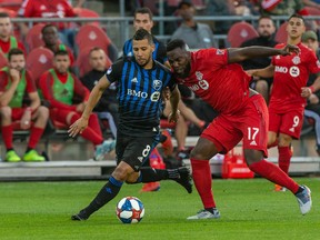Toronto FC forward Jozy Altidore (17) battles for the ball against Montreal Impact midfielder Saphir Taider (8) during the first half on Saturday night. Kevin Sousa-USA TODAY Sports