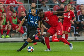 Toronto FC forward Jozy Altidore (17) battles for the ball against Montreal Impact midfielder Saphir Taider (8) during the first half on Saturday night. Kevin Sousa-USA TODAY Sports