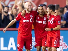 Toronto FC defender Justin Morrow, centre, celebrates scoring a goal against the Montreal Impact during the second half with teammates at Rogers Centre.  Kevin Sousa-USA TODAY