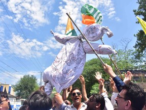 Pakistani Kashmiri hold an effigy of Indian Prime Minister Narendra Modi during a protest in Muzaffarabad, the capital of Pakistan-controlled Kashmir, on August 8, 2019. (SAJJAD QAYYUM/AFP/Getty Images)