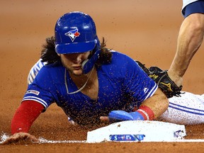 Bo Bichette of the Blue Jays is caught stealing third base by Kyle Seager of the Mariners at Rogers Centre on August 17, 2019 in Toronto. (Vaughn Ridley/Getty Images)
