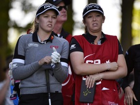 Brooke Henderson, left, with her caddie and sister Brittany Henderson on the second hole tee box during the first round of the CP Women's Open at Magna Golf Club in Aurora, Ont., on Thursday, Aug 22, 2019.