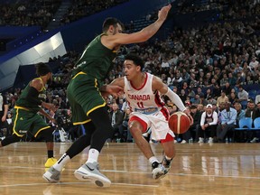 Canada’s Andrew Nembhard moves past Australia’s Andrew Bogut during a friendly match in Perth, Australia, yesterday. (Getty Images)