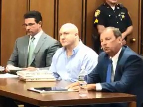 Thomas Knuff Jr., centre, is pictured in court. (cleveland.com screengrab)