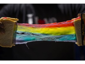 Stretching the Rainbow Grilled Cheese, by food vendor, Ponchos during the CNE Media Preview in Toronto, Ont.  on Wednesday August 14, 2019.  The CNE opens on August 16 and runs until September 2.