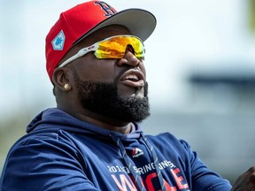 Former player David Ortiz walks on the field prior to a spring training game between the Boston Red Sox and the Minnesota Twins at JetBlue Park in Fort Myers, Fla., on March 3, 2019.