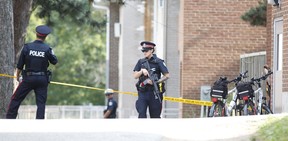 Heavily armed Toronto Police officers responded after two men were wounded by gunfire and a Hyundai Sonata was riddled with bullet holes at a low rise apartment complex on Rochefort in Flemingdon Park on Wednesday, Aug. 7, 2019. (Ernest Doroszuk/Toronto Sun/Postmedia Network)