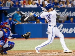 Brandon Drury of the Toronto Blue Jays hits a grand slam against the Texas Rangers in the fourth inning during their MLB game at Rogers Centre on Aug. 12, 2019 in Toronto.