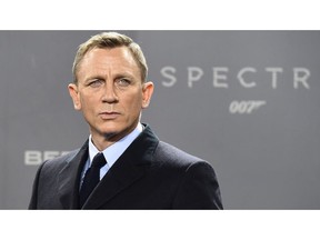 British actor Daniel Craig poses for photographers at a photocall for the new James Bond film 'Spectre' on October 28, 2015 in Berlin.