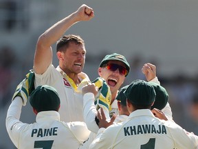 Australia's James Pattinson celebrates taking the wicket of England's Stuart Broad Action. (Images via Reuters/Lee Smith)