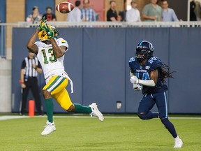 Edmonton Eskimos' Ricky Collins Jr. catches a touchdown against Toronto Argonauts' Abdul Kanneh during the first half of CFL football action in Toronto, Friday, Aug. 16, 2019.