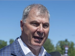 Randy Ambrosie, commissioner of the Canadian Football League, talks with reporters before the Montreal Alouettes and Toronto Argonauts game in Moncton, N.B. on Sunday, Aug. 25, 2019.