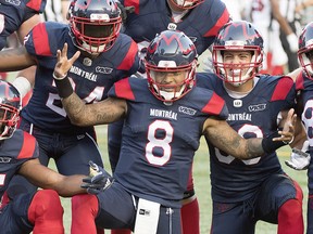 Alouettes quarterback Vernon Adams Jr., (8) celebrates with teammates after scoring a touchdown during first half CFL football action against the Ottawa Redblacks in Montreal, Friday, August 2, 2019. THE CANADIAN PRESS/Graham Hughes
