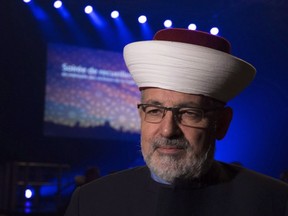 Imam Hassan Guillet arrives at a gathering at the Pavillon de la Jeunesse, marking the first anniversary of the mosque shooting, Sunday, Jan. 28, 2018 in Quebec City.