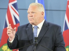 Ontario Premier Doug Ford(L) announces funding for new closed circuit cameras on Friday August 23, 2019. (Veronica Henri/Toronto Sun/Postmedia Network)