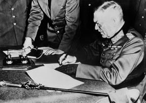 In this file photo taken on May 8, 1945, German field marshal and German chief-of-staff Wilhelm Keitel signs the German definitive act of surrender at the headquarters of the Soviet forces in the Berlin suburb of Karlshost. (AFP/Getty Images)