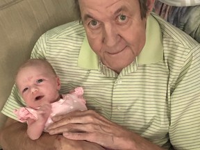 Ted Woloshyn is pictured with his granddaughter in 2019.
