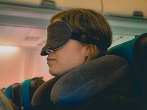 A neck pillow and eye mask can help you get some rest while flying.