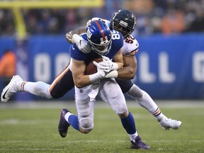 Rhett Ellison #85 of the New York Giants is tackled by Khalil Mack #52 of the Chicago Bears during the second half at MetLife Stadium on December 02, 2018 in East Rutherford, New Jersey. (Photo by Sarah Stier/Getty Images)