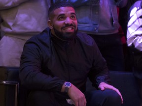 Toronto rapper Drake watches a screen alongside other Toronto Raptors fans as they gather to watch Game Six of the NBA Finals outside of Scotiabank Arena on June 13, 2019 in Toronto, Canada.