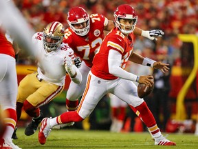 Patrick Mahomes of the Kansas City Chiefs scrambles for yardage in pre-season action against the San Francisco 49ers at Arrowhead Stadium on August 24, 2019 in Kansas City, Missouri. (Photo by David Eulitt/Getty Images)