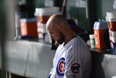 Jon Lester of the Chicago Cubs sits in the dugout during the fourth inning against the Oakland Athletics at Wrigley Field on August 06, 2019 in Chicago, Illinois. (Photo by Stacy Revere/Getty Images)
