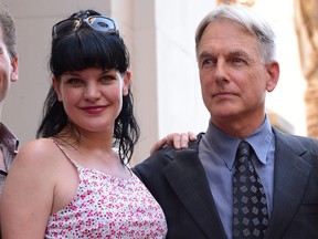 Actors Pauley Perrette and Mark Harmon pose as Mark Harmon is honoured with the 2,482nd star on the Hollywood Walk of Fame on Oct. 1, 2012 in Hollywood, Calif.