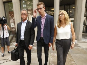 Craig Stevenson, left, son Connor and wife Jo-Anne Finney outside court at 361 University Ave. after giving victim impact statements on Tuesday, Aug. 6 in the sentencing of Eaton Centre shooter Christopher Husbands. Connor was 13 when he was shot after Husbands opened fire in 2012 in the Eaton Centre food court.