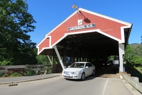Picturesque covered bridge beside Hwy. 16, over Ellis River, at entrance to Jackson, N.H., was built in 1876 — one of more than 50 covered bridges in New Hampshire. (Ian Robertson)