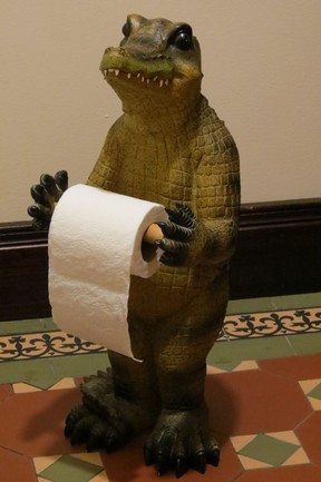 Crocodile toilet paper dispenser in public washroom beside lobby at Adventure Suites. (Ian Robertson)