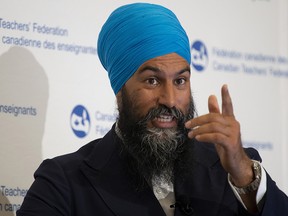NDP leader Jagmeet Singh gestures to a section of the crowd as he speaks to the Canadian Teachers Federation annual general meeting in Ottawa, Thursday July 11, 2019. (THE CANADIAN PRESS/Adrian Wyld)