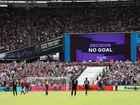 The big screen displays a VAR review message after a goal from Manchester City's Gabriel Jesus was controversially disallowed against West Ham United in English Premier League action. (David Klein/Reuters)