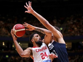 Khem Birch of Canada lays up a shot under pressure from Brook Lopez of the U.S.A. during an exhibition game at Qudos Bank Arena on August 26, 2019 in Sydney, Australia. (Mark Kolbe/Getty Images)