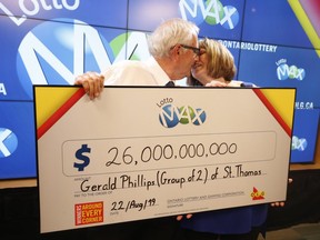 Gerry and Helen Phillips of St. Thomas, Ontario accept their $26 million  cheque from the Ontario Lottery Corporation head office on Thursday.