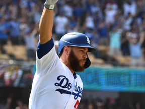 Dodgers catcher Russell Martin, shown celebrating after hitting a two-RBI single for a walk-off win against the 
St. Louis Cardinals earlier this month, has enjoyed his time L.A. despite 
a diminished role. (GETTY IMAGES FILE)