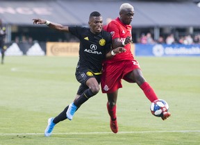 Toronto FC defender Chris Mavinga (right) clears the ball away from Columbus Crew SC midfielder Luis Diaz. Mavinga was involved in a serious car accident on Sunday after arriving back in Toronto from Columbus. (Greg Bartram/USA TODAY Sports)