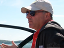 Businessman Kevin O'Leary behind the wheel of one of his boats on Lake Joseph.
