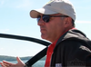 Businessman Kevin O’Leary behind the wheel of one of his boats on Lake Joseph.