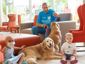 McDonald's Canada founder George Cohon with his therapy dogs Simmie and Annie at a Ronald McDonald House Charities Toronto summer camp. (supplied photo)