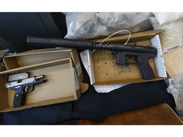 York Regional Police unveiled drugs (meth, cocaine, fentanyl, cannabis bound for U.S.), weapons (Ruger, left and Tec-9 with a silencer) and proceeds of crime during two unrelated Projects called Zen and Moon targeting organized crime arresting 49 people on Thursday August 8, 2019. Jack Boland/Toronto Sun/Postmedia Network