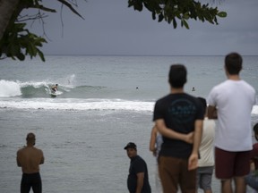 People gather at the coast hours before the storm enters in Patillas, Puerto Rico on, August 28, 2019. (ERIC ROJAS/AFP/Getty Images)