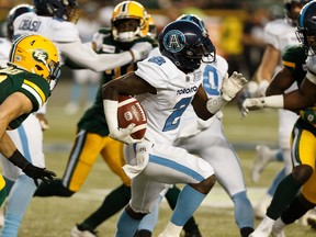 Argonauts’ Chris Rainey is chased by Edmonton Eskimos’ defenders during the second half of a game last month. Rainey has been an explosive presence in 
the return game. (Ian Kucerak/Postmedia  Network)