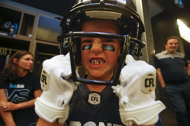 Darius Raso, a seven-year-old boy from Kleinburg, Ont. who has been battling acute lymphocytic leukemia for the past year, signed a one-day contract with the Toronto Argonauts on Thursday, Aug. 29, 2019. (Jack Boland/Toronto Sun/Postmedia Network)
