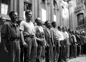 In this file photo taken on August 20, 1944, armed resistant fighters of the FFI (French Forces of the Interior) gather in the courtyard of Paris City Hall, during the battle for the Liberation of Paris, during the Second World War. (STF/AFP/Getty Images)
