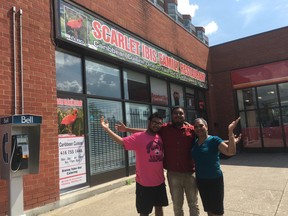 Super cook May and her kids, Jason and Brandon, out front of Scarlet Ibis Family Restaurant’s new location on Dean Park Rd. in Scarborough. (Joe Warmington/Toronto Sun/Postmedia Network)