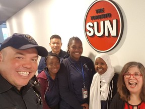 PC Peter De Quintal with his Youthinpolicing students Kunteng Wang, Shaneik Harris, Kayla Williams and Ilwad Hashi. along with Rita DeMontis during a recent visit to the Toronto SUN photo courtesy PC De Quintal)